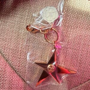 NWOT Authentic CHANEL Gold Star and Silver Camellia Flower Charm.